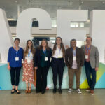 Institute team in front of ACEP sign